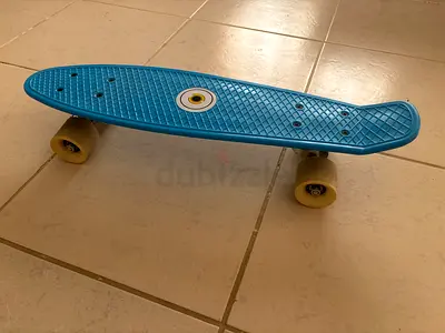Light Blue junior Cruiser Skateboard - Compact Penny Style. Oxelo