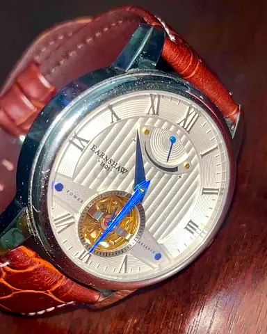 T.E. “Tourbillon” Flywheel watch with Powe reserve indicator