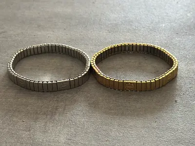 Pair of Gold and Silver Cartier Toned Stretch Bracelets
