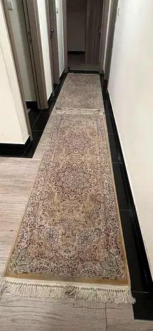 Long narrow Persian-style runner rug — good used condition