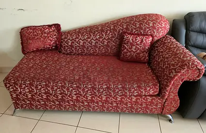 Red patterned chaise lounge sofa - single arm, good condition