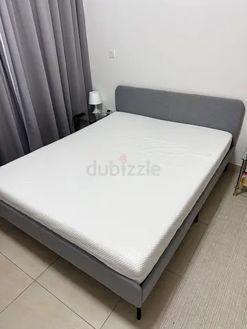 Queen grey fabric bed frame with mattress (always used with a waterproof cover)