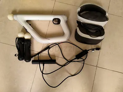 PlayStation VR headset with Move controllers and Aim attachment