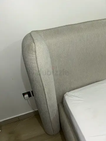 Ivory upholstered bed frame (king) - less then a year old with mattress