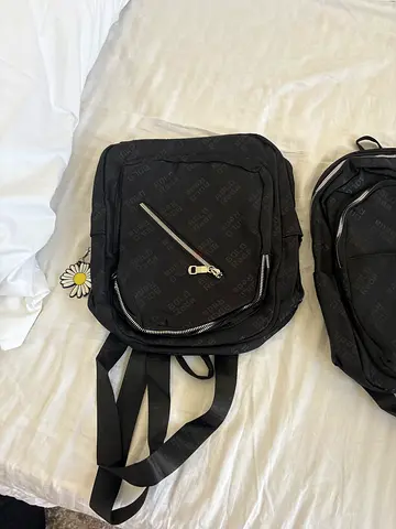Black nylon backpack with front zipper pocket - good condition