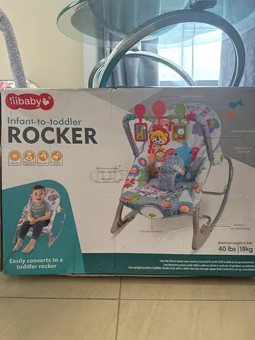 Tiibaby /Infant-to-Toddler Rocker (like new, with toys)