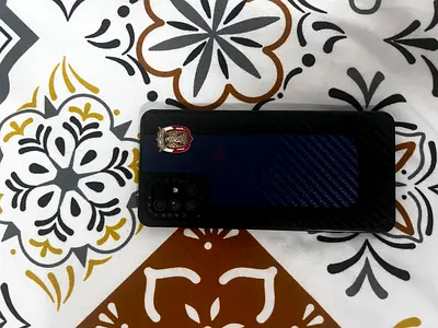 Used Samsung A71 smartphone with protective case - good condition