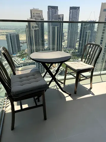 Table and three chairs