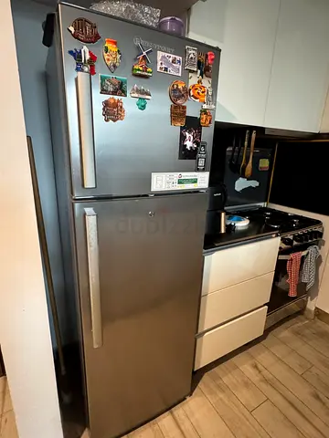Used stainless steel double-door fridge in good condition