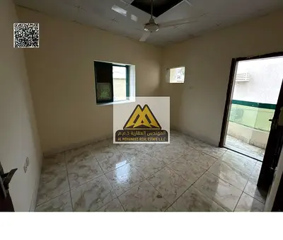 1-bedroom apartment in Al Rashidiya 1, spacious layout with balcony. AED 22K yearly, 4 or 6 payments, opposite Fish Market on Al Mina Street, close to