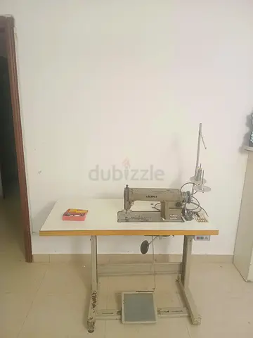 Used Juki Industrial Sewing Machine on Work Table with Foot Pedal