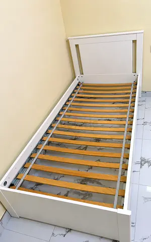 Single bed with side table