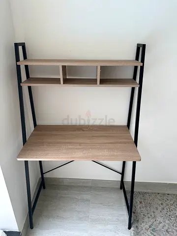 Compact wooden study desk with shelving and black metal frame