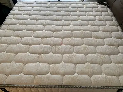 Queen mattress and leather frame in excellent condition — clean, firm comfort 800 AED for each