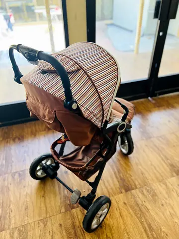 Used Brown 3-Wheel Baby Stroller with Canopy