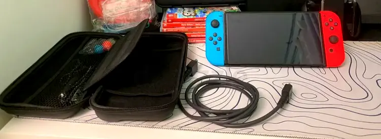 Nintendo switch with 50 games and 2 controllers and with all accessories available for sale at 1900