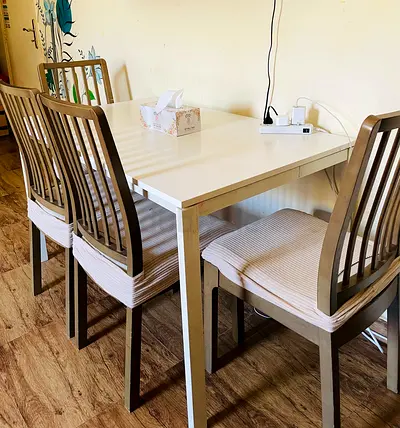 White dining table with 4 wooden chairs - good condition