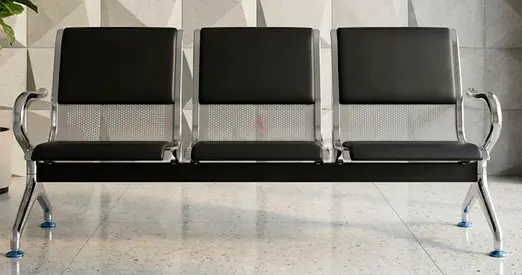 Three-seat metal waiting room bench in good condition