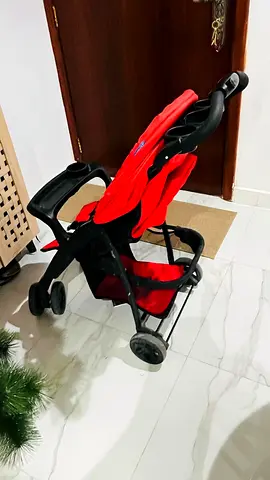Lightweight red baby stroller – good condition