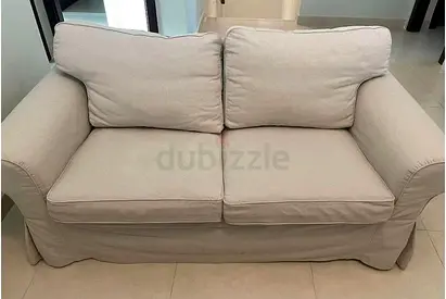 2-Seater Beige Fabric Sofa - Good Condition
