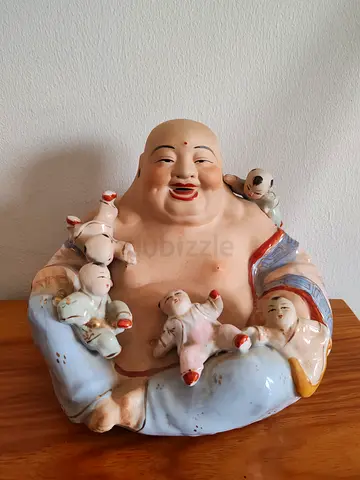 Laughing Buddha with babies