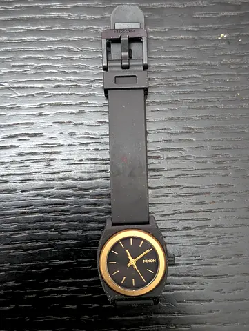 Nixon womens Black Silicone Watch with Gold Dial — Good Used Condition
