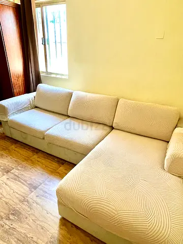 Light beige L-shaped fabric sofa – 4-seater with chaise (good condition)