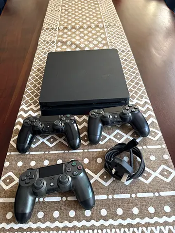 PlayStation 4 Slim 1TB with 3 Controllers and Power Cable - Good Condition
