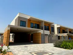 A modern corner villa located within the upscale Azha compound in the Al Amrah area of ​​Ajman, 
