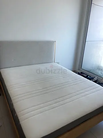 Solid wood single bed frame with upholstered headboard