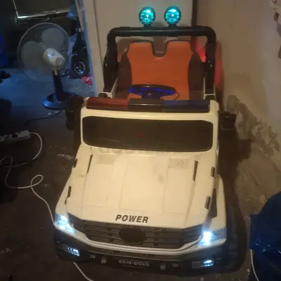 Used White Electric Ride-On Toy Car for Kids with Working Lights