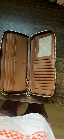Michael Kors Brown zip-around leather long wallet with multiple card slots and ID window