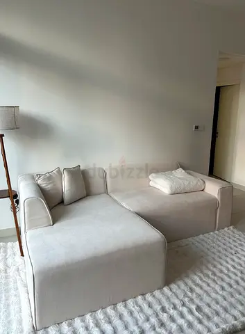 Beige L-shaped fabric sofa (good condition)