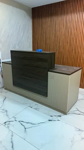Modern reception desk / front counter in wood finish - good condition