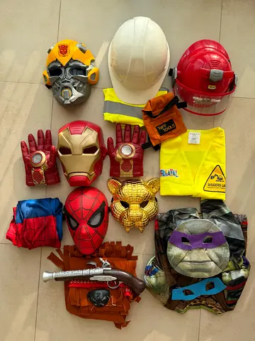 Mixed kids superhero and role-play costume set — helmets, masks, gloves, props (used)