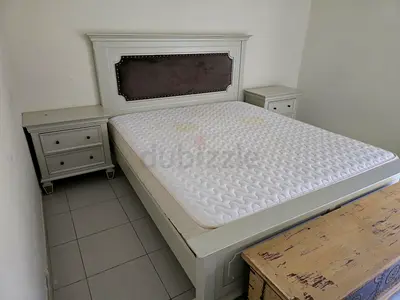 Queen-size bed frame with headboard and two bedside tables - white