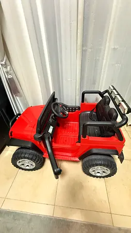 Red rechargeable -Powered Kids Jeep Ride-On - Good Condition