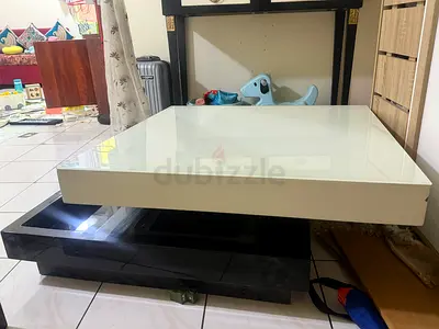 Modern low-profile lacquered coffee table (white top, black base)