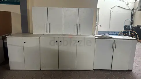 Used white kitchen cabinet set with sink — multiple units