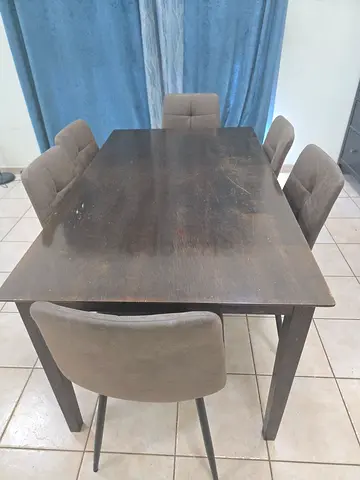 Dark Wood Dining Table with six Fabric and metal Chairs