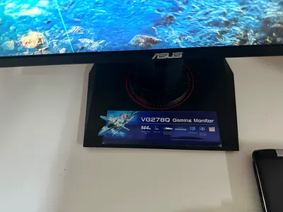 ASUS VG278Q 27 Gaming Monitor (144Hz) with keyboard and white ikea table
