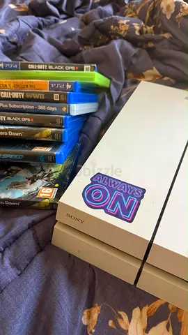 White Sony PlayStation 4 Slim with 7 Games perfect condition
