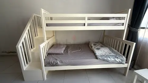White wooden bunk bed with stairs — good condition