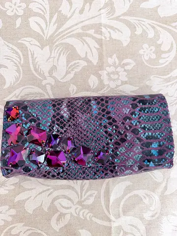 Python clutch woman