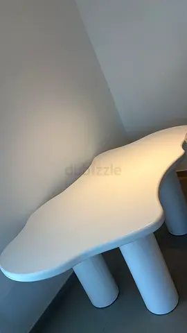 Modern Designer Dining Table – AED 600 Unique sculptural dining table with a smooth white finish and