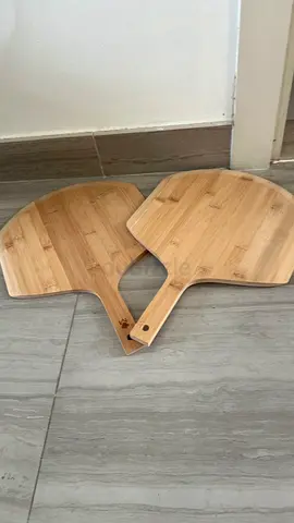 Pair of wooden food serving paddles.