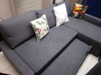 Gray L-shaped Sofa with Pull-out Bed - Good Condition