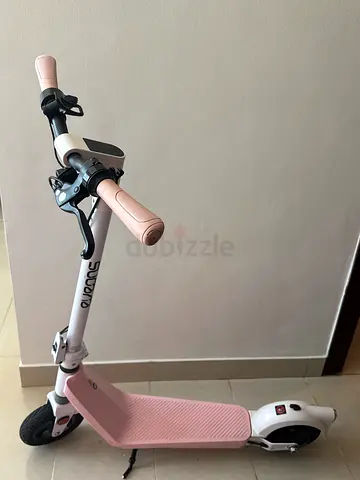 Lightly used pink electric scooter with brake and LED headlight (negotiable)