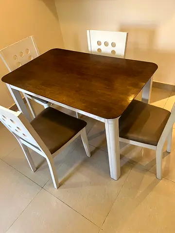 Wooden dining table with 4 padded chairs