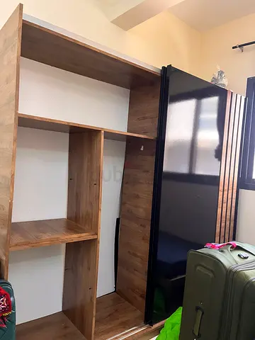 Two-door sliding wardrobe in wood finish with black gloss doors - good condition
